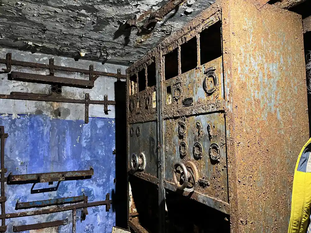 Rusty metal control panel with gauges and switches